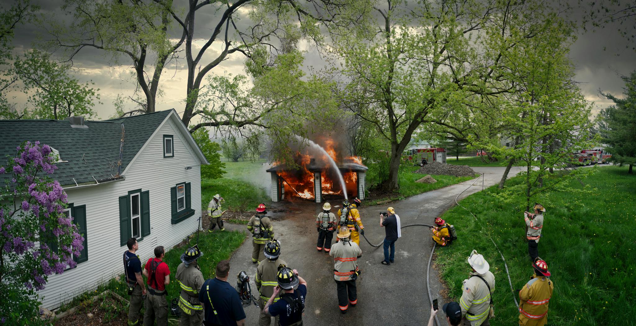 A team of firefighters training to extinguish a burning garage in Racine, WI.